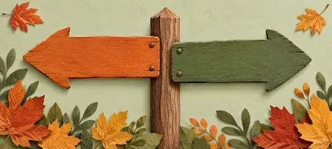 Wooden signpost with an orange arrow and a green arrow